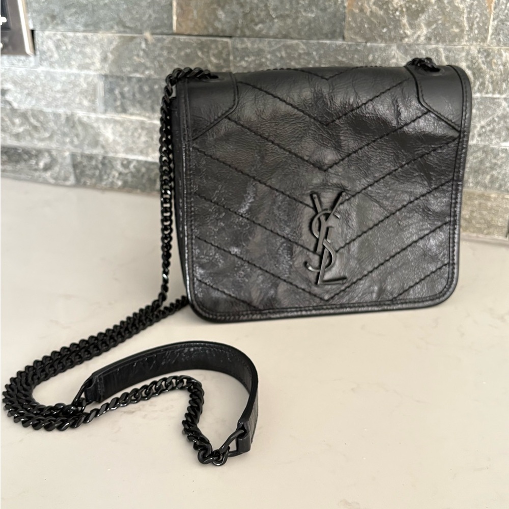 YSL black wallet on a chain.